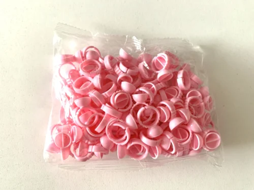 ANILLOS DESECHABLE CÓNCAVO - PLÁSTICO ROSA CON DIVISIÓN - (x100)