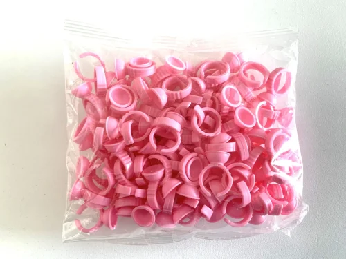 ANILLOS DESECHABLE CÓNCAVO - PLÁSTICO ROSA SIN DIVISIÓN - (x100)